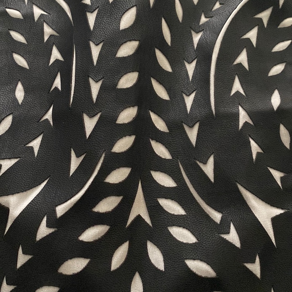 fancy black top, short in the front long in the back.